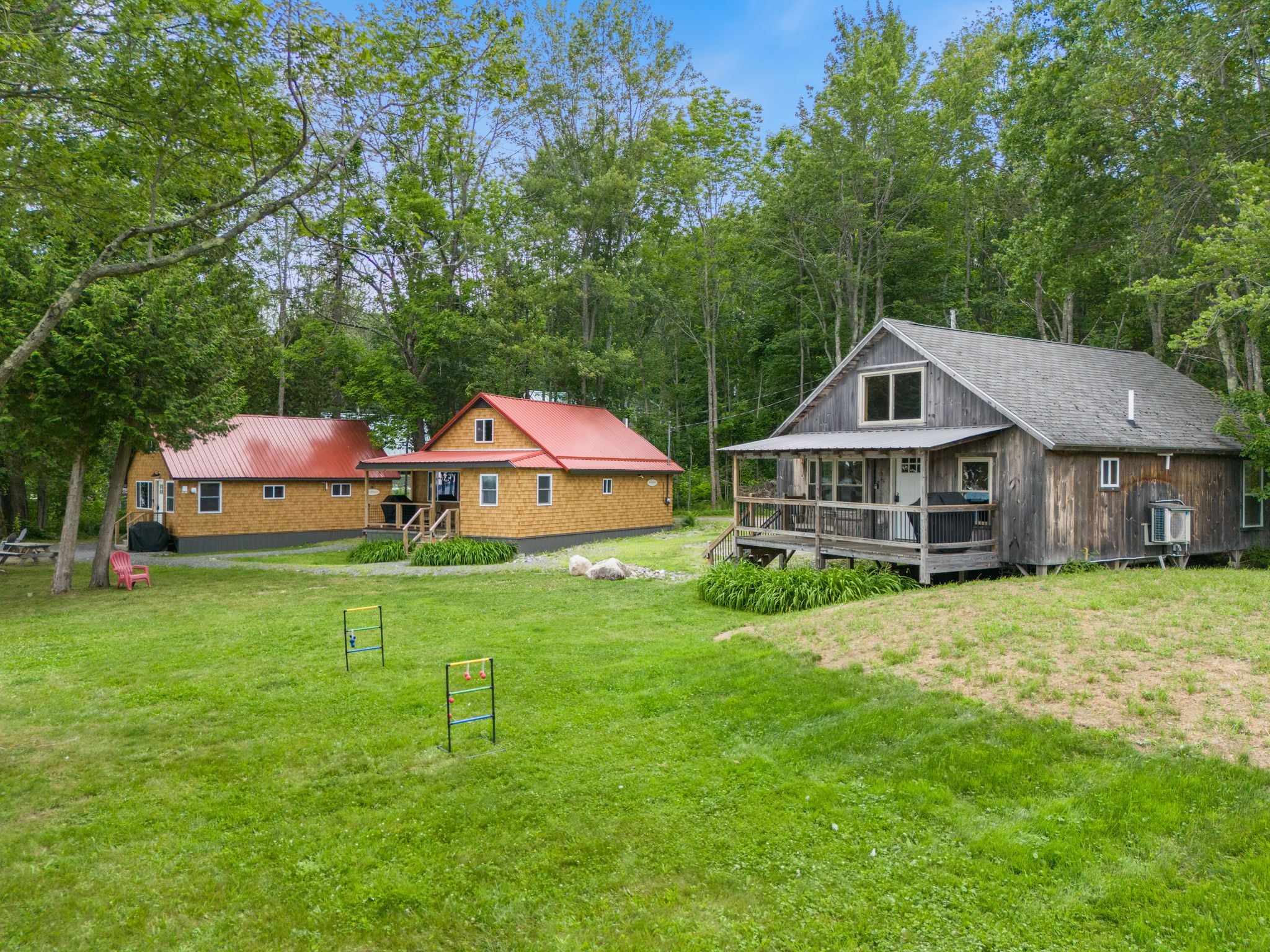 Traditional cabins among the trees at Lake Winnecook